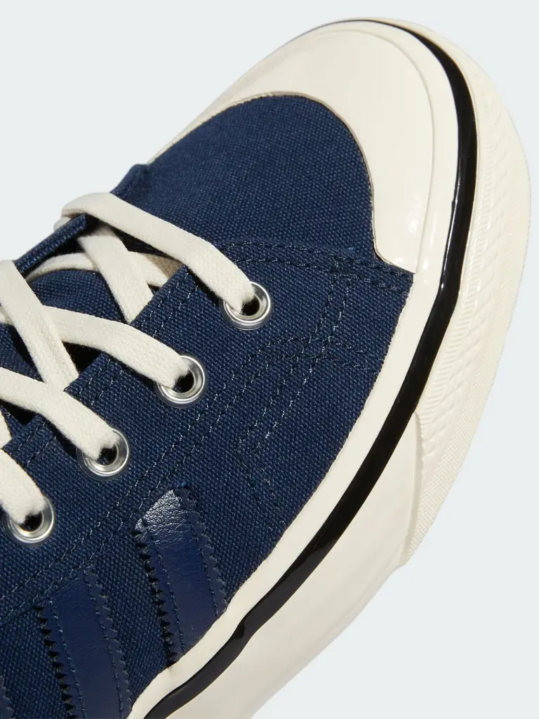 df80d54b-0410-435f-ab27-e1afafeb97d41685342851890ADIDASOriginalsMenNavyBluePrintedHigh-TopSneakers6.webp